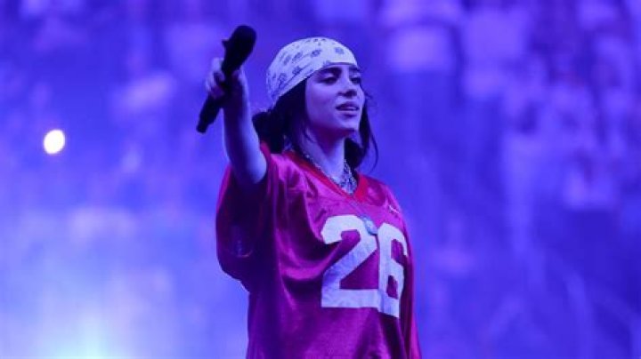 Billie Eilish singing on stage